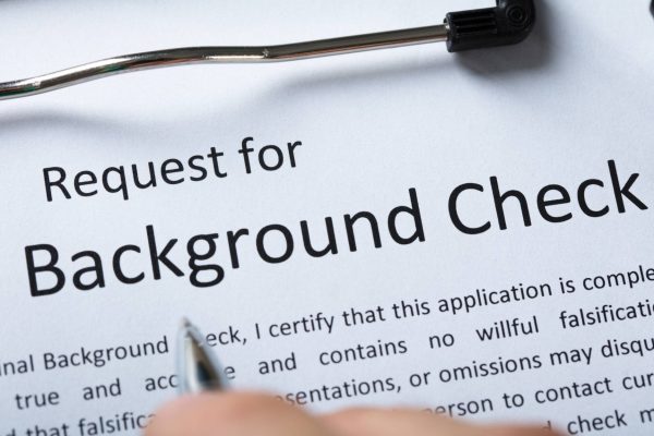 Close up of a sheet of paper with the words "Request for Background Check" across the top in big letters.